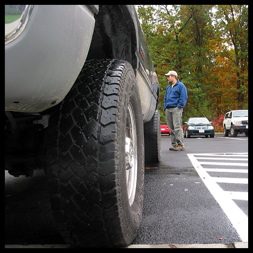 Paul standing in a parking lot next to his new truck; 30 Oct 2002